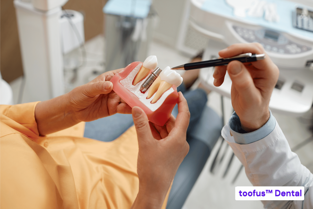 Dentist discussing whether dental implants are suitable for a patient – toofus™ Dental