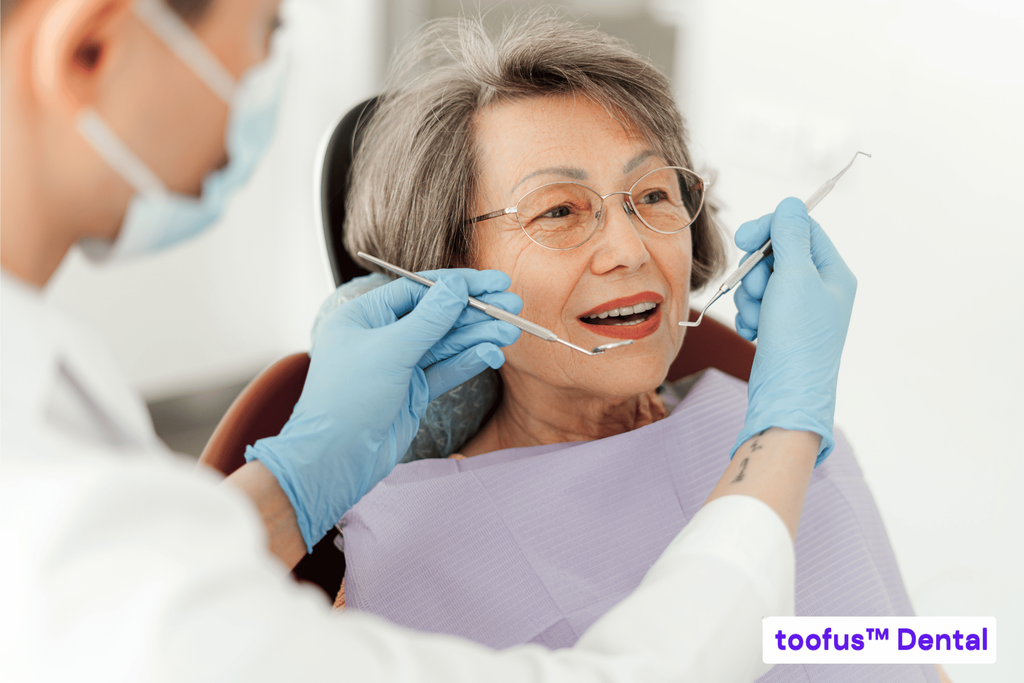 5 Questions to Ask Before Committing To Dentures 1 Senior consulting a dentist on denture treatment – toofus™ Dental